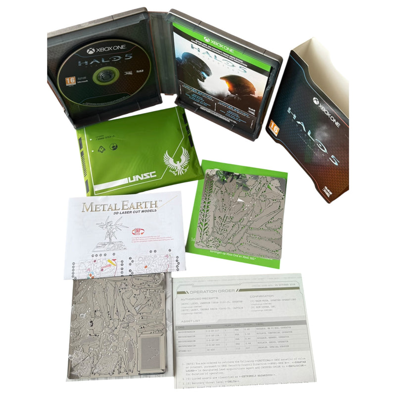 Halo 5 game disc and packaging with accessories on a white background