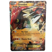 A single Pokémon trading card for Groudon EX, shown flat against a plain light background. The card features artwork of Groudon with red, black, and gold/yellow energy effects, and visible text including 'Groudon EX', 'hp 180', and move names 'Rip Claw' and 'Massive Rend'.
