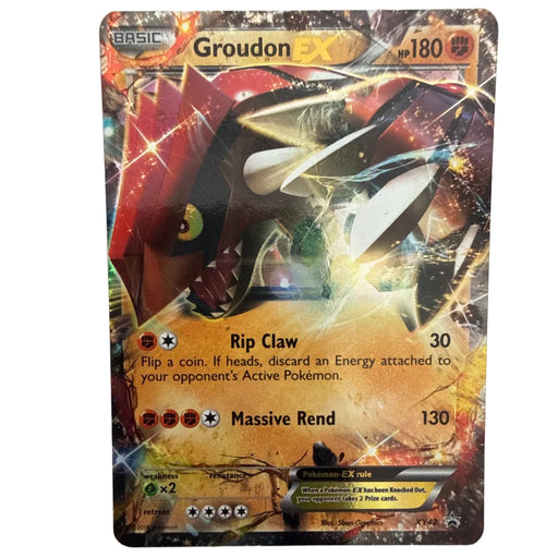 A single Pokémon trading card for Groudon EX, shown flat against a plain light background. The card features artwork of Groudon with red, black, and gold/yellow energy effects, and visible text including 'Groudon EX', 'hp 180', and move names 'Rip Claw' and 'Massive Rend'.