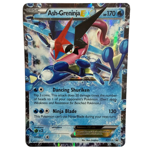 A single Ash-Greninja EX trading card from the Pokémon Basic set, photographed flat against a light neutral background. The card features holographic foil, a blue and red Greninja illustration, and printed game text including 'Dancing Shuriken' and 'Ninja Blade'.