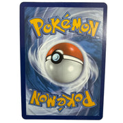 A single Pokémon trading card featuring the classic red-and-white ball design on a blue swirling background, with the Pokémon logo in yellow at the top and mirrored at the bottom, photographed against a plain light wall.