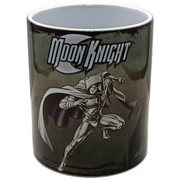 A ceramic mug featuring a graphic of the Marvel character Moon Knight in a dynamic pose against a dark, textured background, with the 'Moon Knight' logo above him.